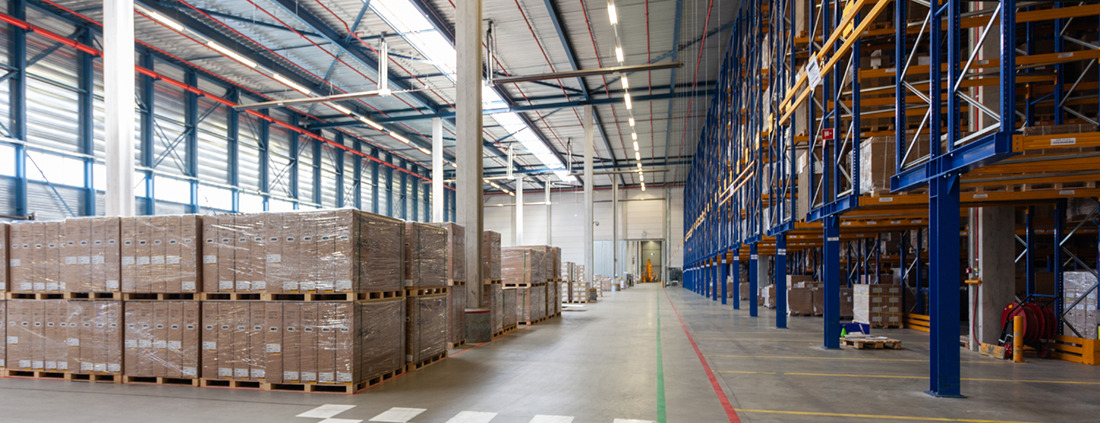 View of full warehouse with forklift